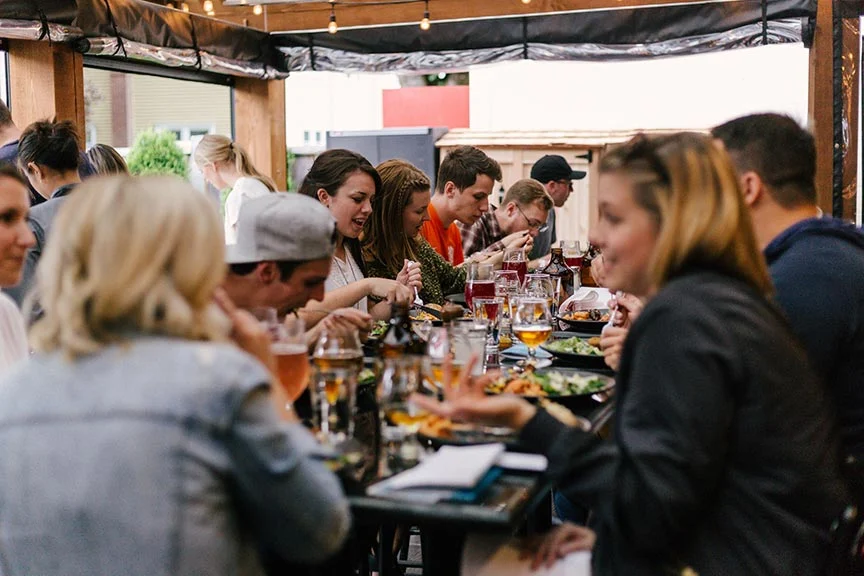 People at a table eating and drinking