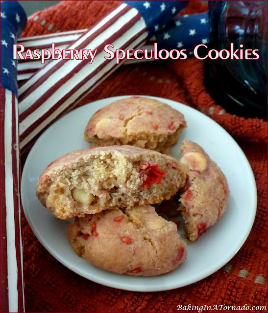 Raspberry Speculoos Cookies, fresh raspberries and white chocolate chips in a cookie butter batter. | recipe developed by www.BakingInATornado.com | #reicpe #bake