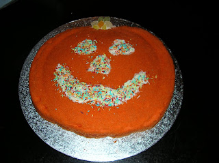 Cake Decorated to look like a carved pumpkin