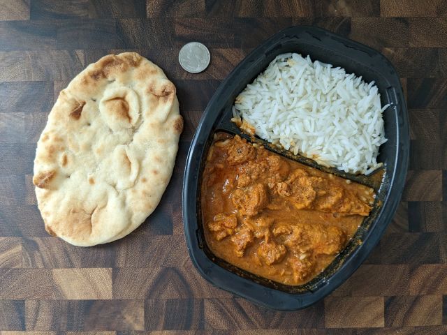 Sukhi's Chicken Curry with naan and quarter for size comparision.