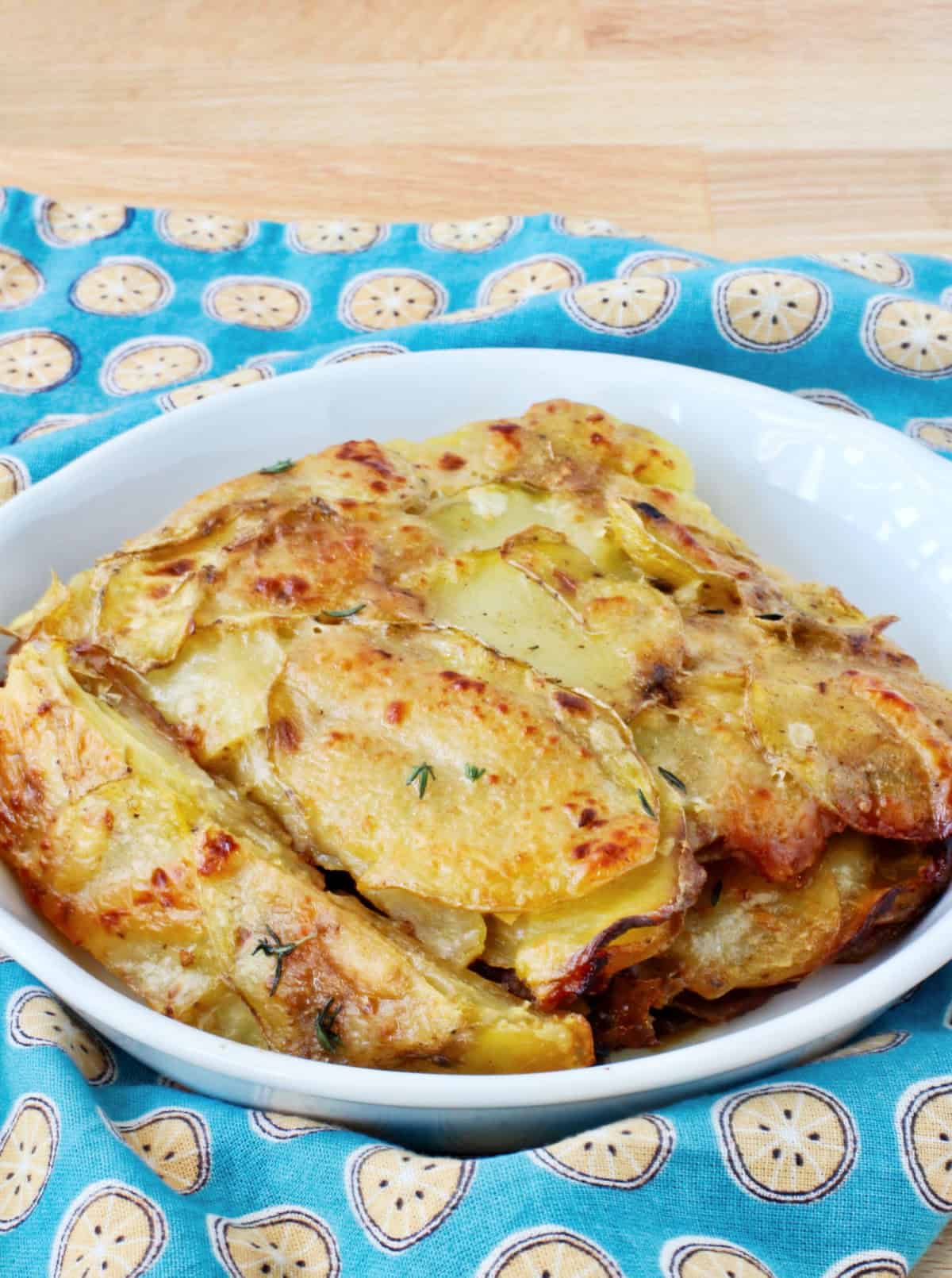 Scalloped potatoes in a gratin dish.