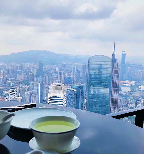 City window view. Drink tea on the 80th floor