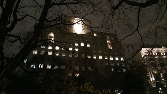Image of an eerie building and tree's on the banks of the thames in london