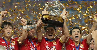 Chinese team players celebrating the championship. Tonight nobody will tell them not to go partying.