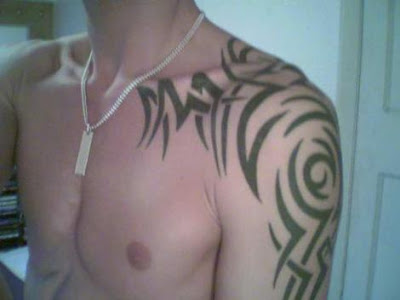 tribal shoulder tattoo designs. Cool Tribal Shoulder Tattoos