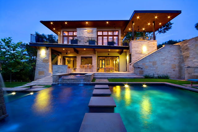 Picture of an amazing modern luxury house as seen from the pool in front of the house
