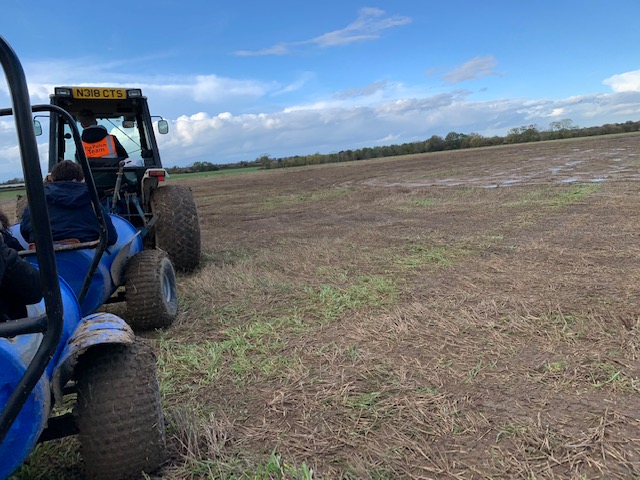 Barrel tractor ride in a field