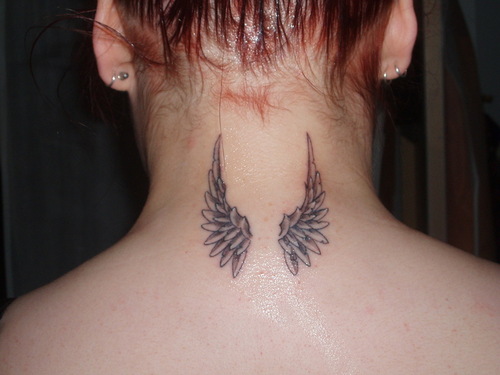 angel holding baby tattoo. Back Piece Tribal Angel Wing