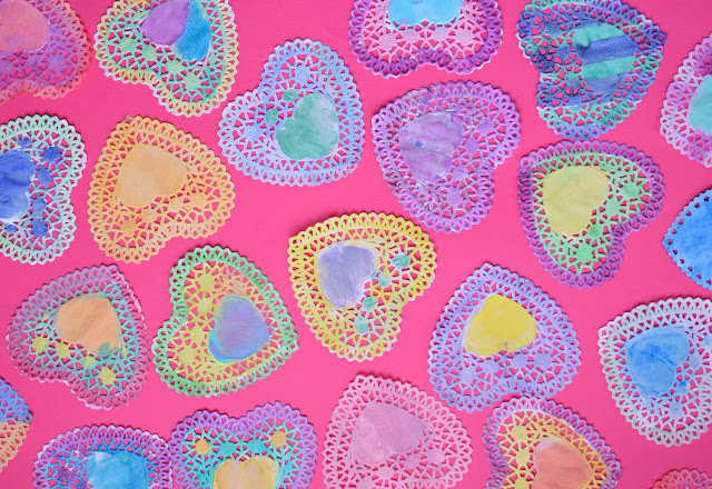 Valentine Suncatchers- Beautiful watercolor heart process art painting project for preschool, kindergarten, or elementary kids. Brighten up a dreary winter day with this pretty, colorful craft!