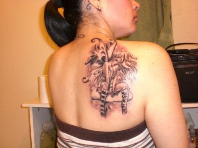 Great Upper Back Tattoo Designs For 2011. Advertisement