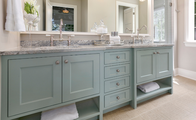 Double bathroom vanity in a light sage green color.