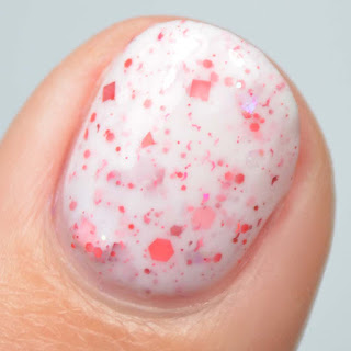 white crelly nail polish with red glitter