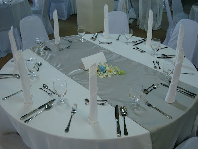 Table settings with silver runner to match silver anniversary theme