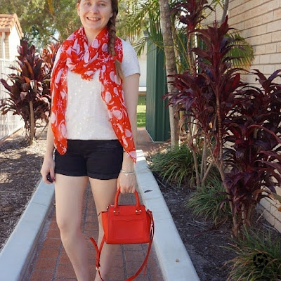 awayfromtheblue instagram christmas shorts and tee outfit star print tee black denim shorts Santa scarf and red bag