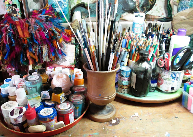 Art supplies and art journals, paint and brushes of Artyshroo, a mixed media artist and illustrator