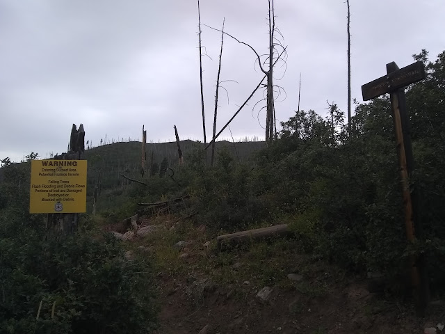 sign way above the trailhead