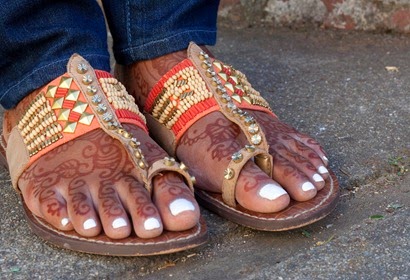 The bride's feet decorated with henna