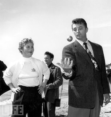 And here is Robert Mitchum impressing Michele Morgan with his juggling 