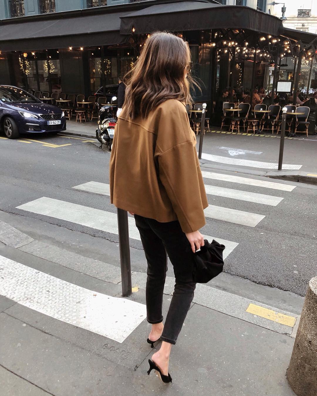 Stylish Instagram Fall Outfit Idea — camel jacket, black skinny jeans, and kitten heel mules