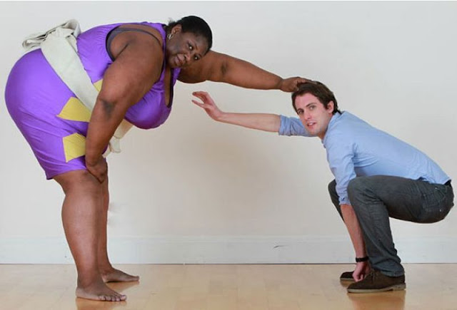 A white man challenges a big black woman