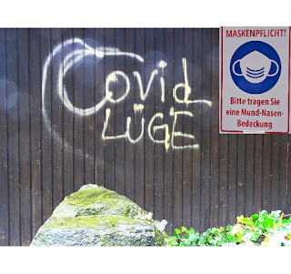 covid_lüge_spray_an_gebäudewand