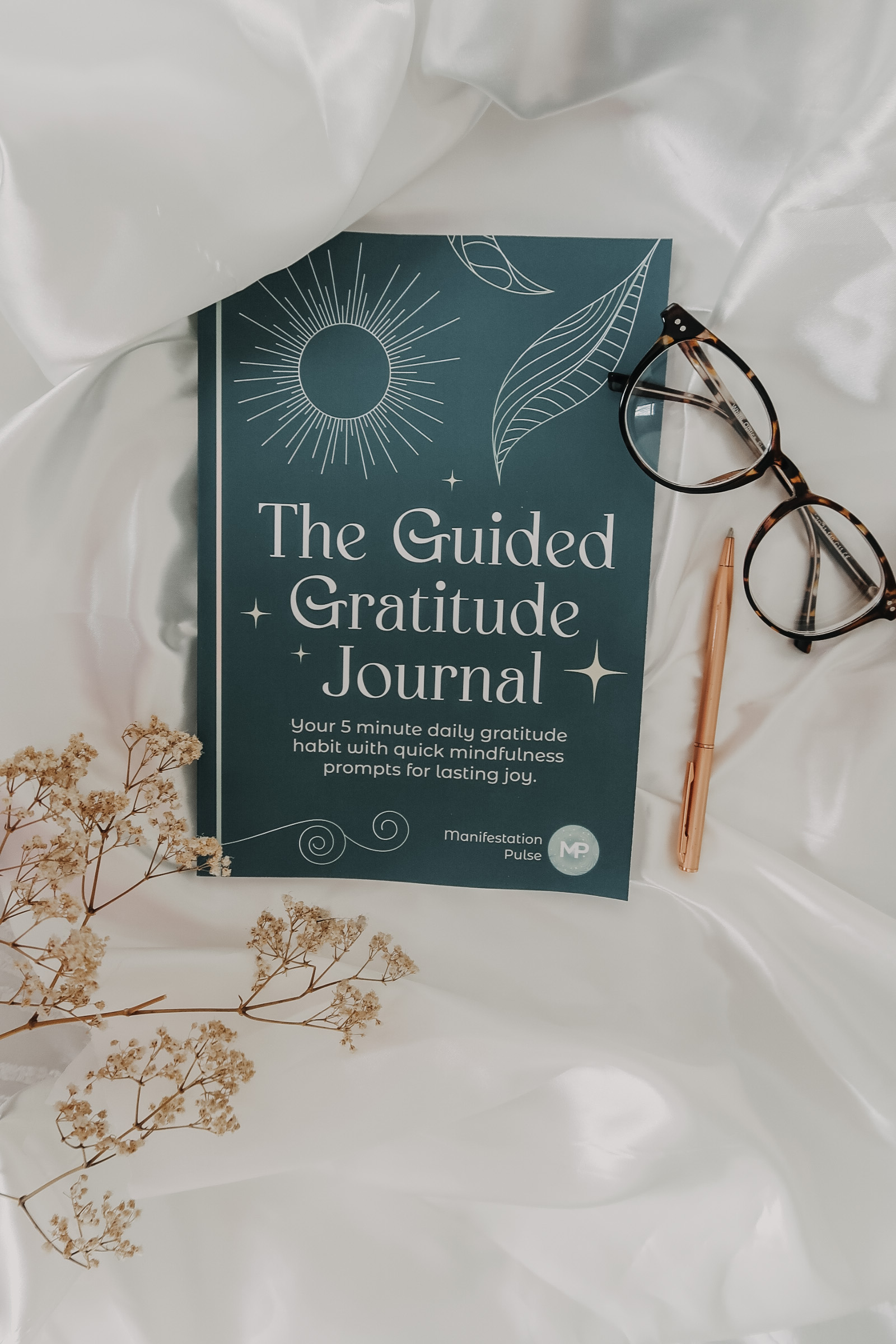 The Guided Gratitude Journal by Manifestation Pulse journal.