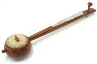 Punjabi-Home-Made-Instrument-Tumbi-Made-of-Wood-And-Leather.jpg