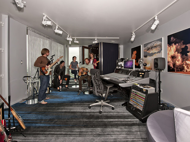 Picture of male band playing in the recording studio in the guest house