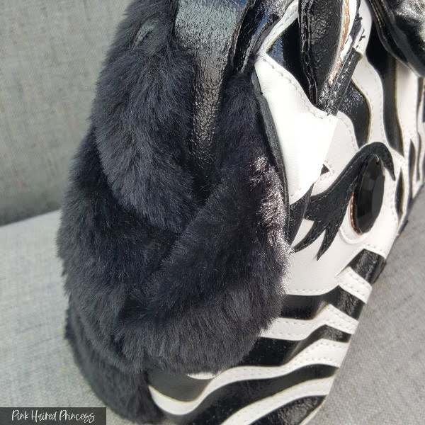 black fur fabric gussets on side of bag