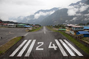 Lukla Airport Runway. The trekking leader Lakpa perked up at everyone's .