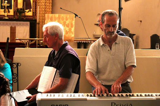 Rex tickles the ivories in a break from recording Cantate Domino