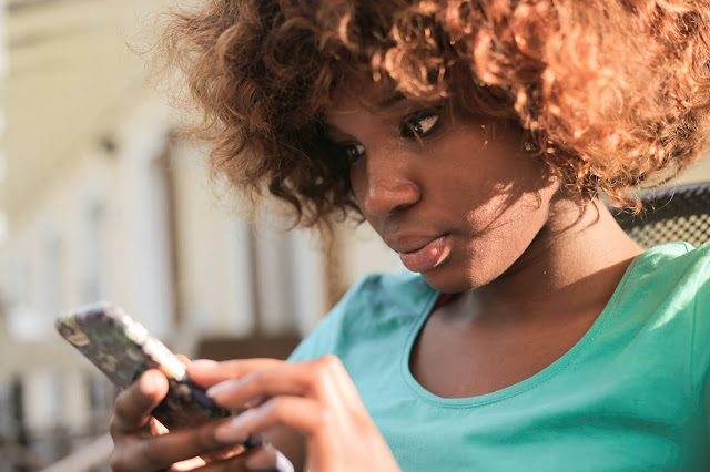 Pretty girl browsing on her phone.