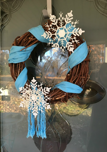 Use a scarf and dollar tree ornaments to make this Winter Snowflake Grapevine Wreath!