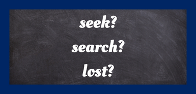 A blackboard background with the words seek, search and lost writtnen in white script with each word followed by a question mark.