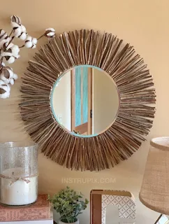 espelho decorativo rústico com galhos secos.