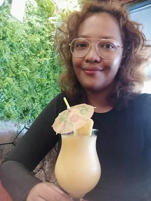 " Shachem Lieuw drinking a mango smoothie at Restoran Bibit in Paramaribo"