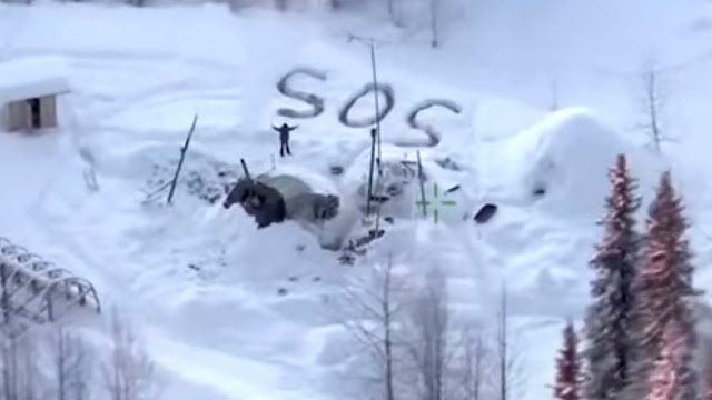 A trooper helicopter crew found an SOS signal stamped in the snow
