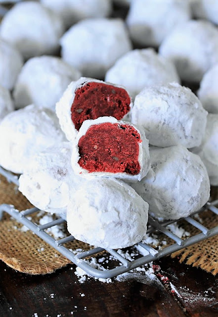 Red Velvet Snowball Cookies on Cooling Rack Image