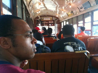 Man takes a ride on the New Orleans Streetcar (interior)