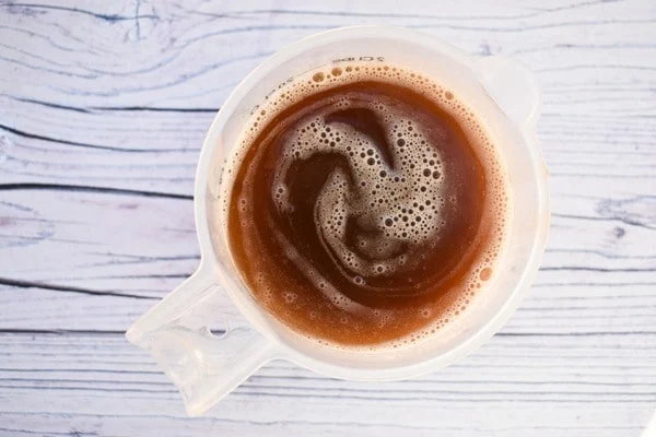 onion gravy in a white measuring jug