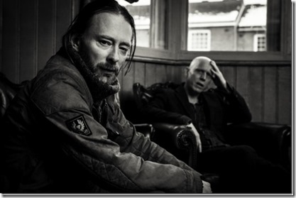 Thom-Yorke-Stanley-Donwood-Sitting-BW-Michael-Muller-x1000-678x451_thumb[1]