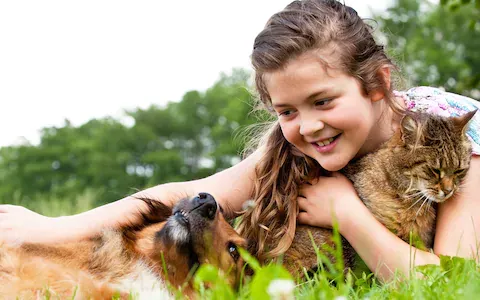 one girl with dog and cat