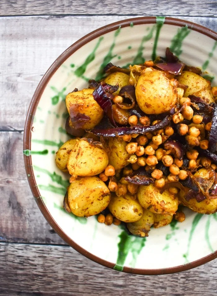 Balti potatoes in a ceramic bowl