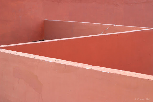 A Minimalist Photo of ZigZag Lines or English Alphabet Z being created by Overlay of Pink walls