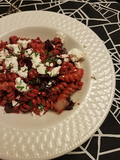 beet pasta with basil pesto and goat cheese