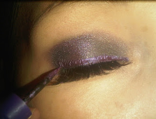 purple eyeliner along the eyelid