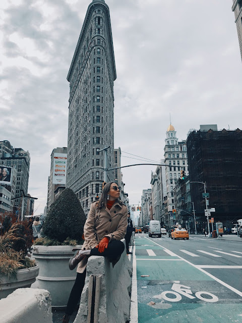 The Flat Iron is located in the 5th Avenue and it's probably one of the most well-known building in NY, which makes it a mandatory stop for you!     Well, getting the perfect shot there? You'll have to find a place where you can get the building and also the idea of a super large avenue, which it actually is! For me it was a sort of small wall in the middle of the street right in front of the building, but there's a cute esplanade there that grants great pictures too!