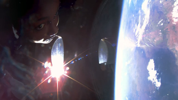 'Galactic 02' passenger Anastatia Mayers stares through one of VSS Unity's porthole windows at the curvature of Earth...on August 10, 2023.