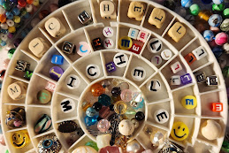 Picture of alphabet beads spelling Michelle and assorted mixed beads