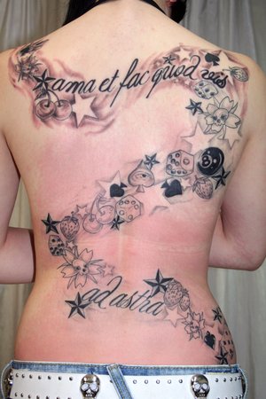The tattoo between Evan Rachel Wood's shoulder blades is a quote by Edgar